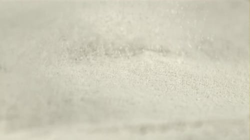 Super Slow Motion Flour Pours Through a Sieve