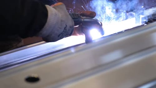Worker Argon Welding Aluminum Profile