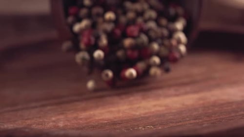 Colorful Peppercorns Poured on Wooden Surface