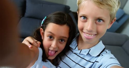 Boy and Girl Smiling and Posing Closely Together