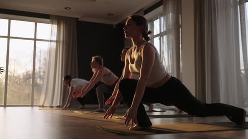 Young Caucasian Sporty People Practicing Yoga Lesson with Instructor