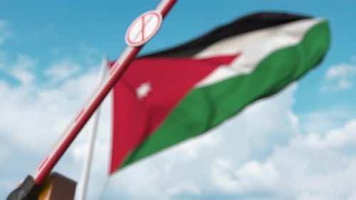 Jordan Flag and Barrier Closing with Coronavirus Sign