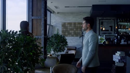 Business Partners Shaking Hands in Luxury Office