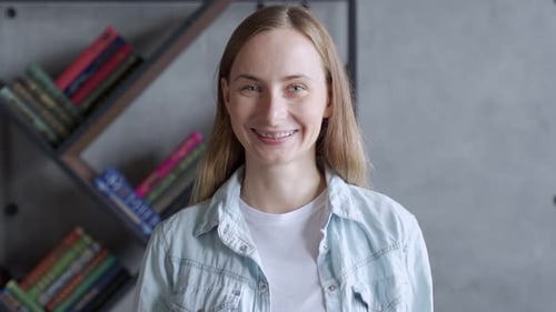 Close Up Portrait of Smiling Woman with Braces. Happy Young Woman with Braces Smiles