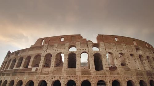 Ancient Colosseum Against Cloudy Sky in Center of Rome