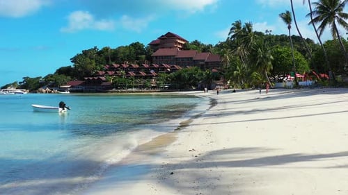 Vacations resort with ocean view on tropical island with trees forest and white sandy beach washed b