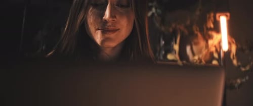 Woman works on laptop