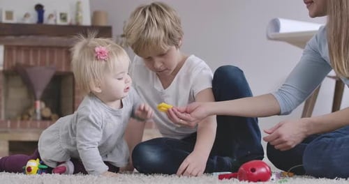 Fair-Haired Children Playing with Toys at Home
