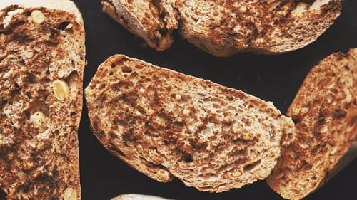 Close Up Marcor Shot of Toasted Baguette Slices Placed on Grill Frame