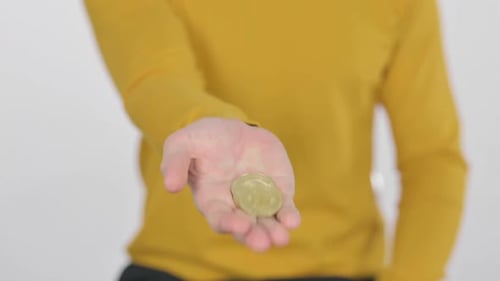 Portrait of Middle Aged Man Holding Bitcoin Crypto Currency