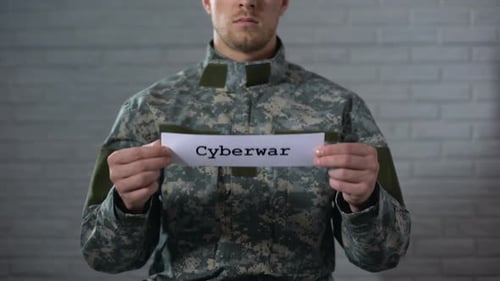 Cyberwar Word Written on Sign in Hands of Male Soldier, Information Security