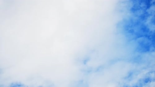 Clouds Drifting Slowly Across a Blue Sky