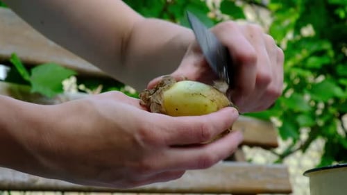 Potato Peeling with Knife in a Rural Setting