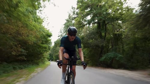 Road biking cyclist man training on bike