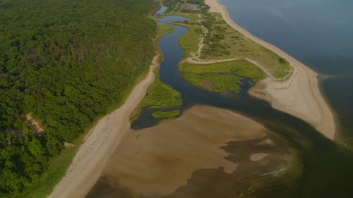 Slow Aerial Tilt Down Inlet on Smithtown Bay Near Dense Forest Trees