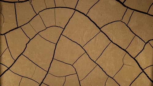 Desert Cracked Soil Drying Out in Time Lapse. Symbol of Climate Change and Drought. Cracked Earth