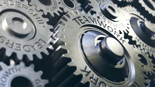 3D Gears Interlocking with Business and Teamwork Words