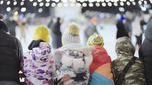 Kids Watching People Skating Ice Rink