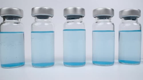 Row of Vials with Light Blue Liquid