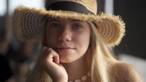 Glamorous Woman with Straw Hat Smiling