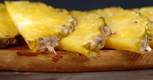 Close up of Pineapple Slices on Wood