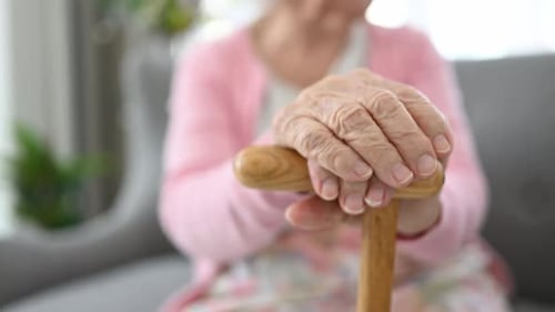 Senior Woman and Walking Stick