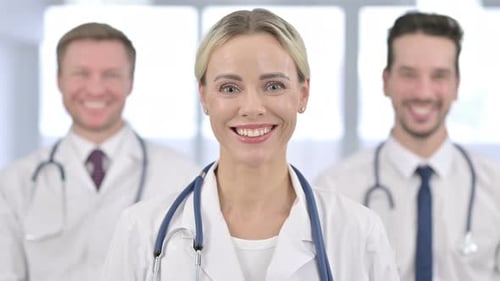 Portrait of Beautiful Female Doctor Smiling at the Camera