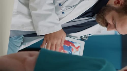 Doctor Showing Heart Diagram on Tablet