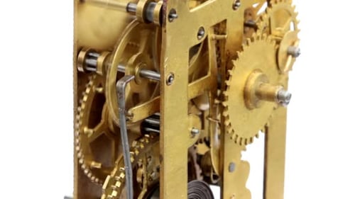 Intricate Clock Gears Spinning in Close Up