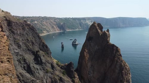 Aerial View From Above on Calm Azure Sea and Volcanic Rocky Shores