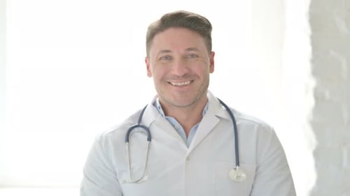 Smiling Doctor Wearing Stethoscope and White Coat