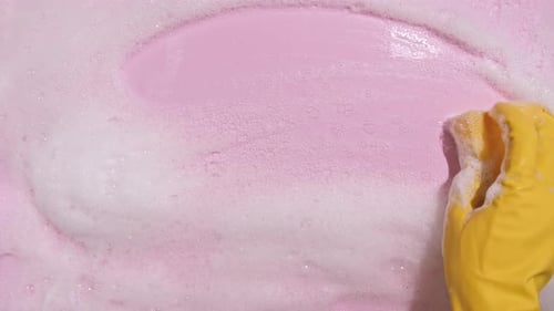 Hand Cleaning Bubbles with Sponge Close Up