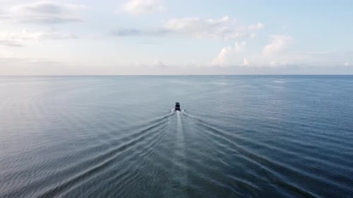 Aerial view follow the back of fishing boat