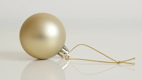 Gold Christmas Ball Ornament Decoration on White Background