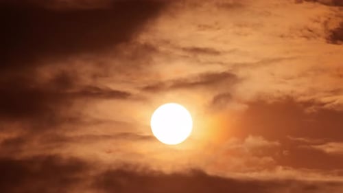 Golden Sun and Clouds at Sunrise or Sunset