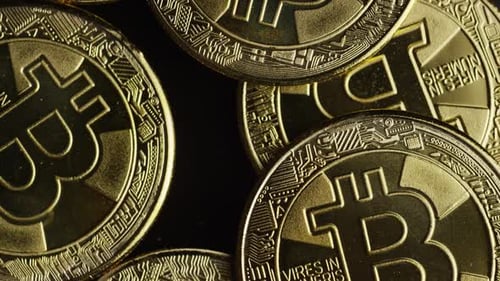 Rotating shot of Bitcoins (digital cryptocurrency)