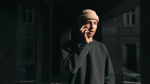 Caucasian Man Having Phone Talk Outdoor. Man Talking on Smartphone at Street.