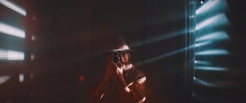 Stylish Man Singing into a Microphone at Night