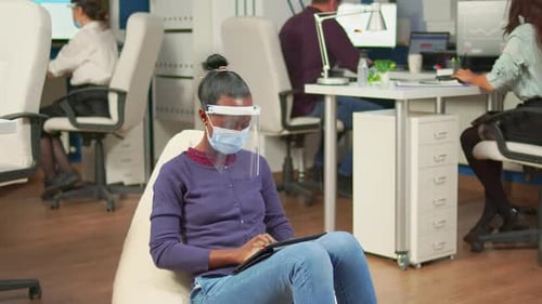 People Working in Modern Office with Masks