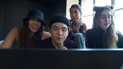 Friends Chatting on Laptop Video Call Indoors