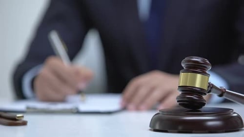 Gavel and Justice on White Table