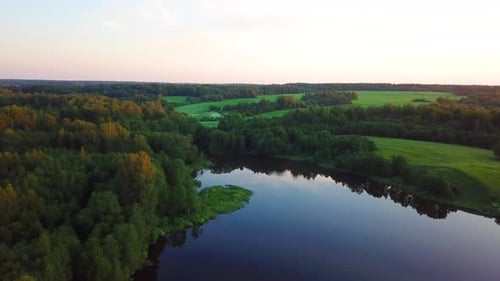 Peaceful Lake and Forest Aerial at Golden Hour