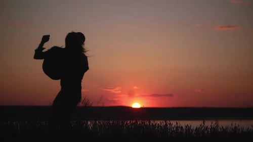 Romantic Couple Silhouette Enjoying Sunrise Together