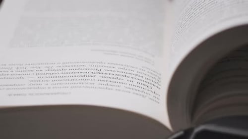 Close Up of Pages in a Book Being Turned