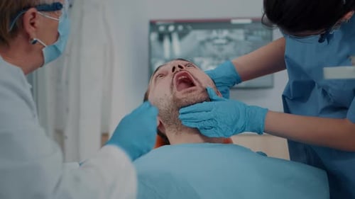 Dentist Examining Patient in Modern Office