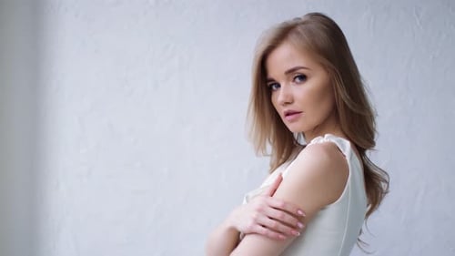 Beautiful Woman Posing Gracefully in Studio