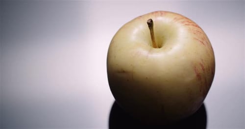 Close Up of an Apple on Gray Background