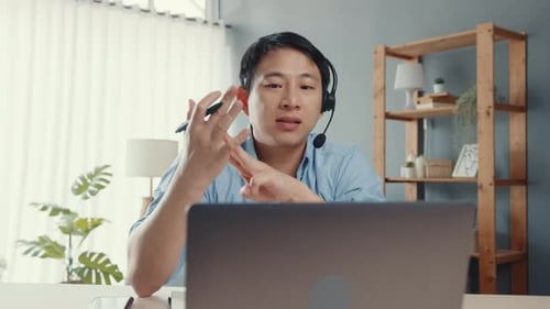 Man Communicating During Video Call at Desk