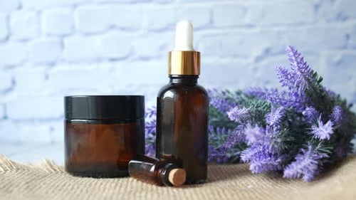 Eucalyptus Essential Oils in a Glass Bottle with Green Leaf on White Background