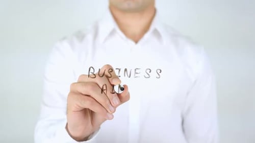 Writing Business Aims on Clear Surface